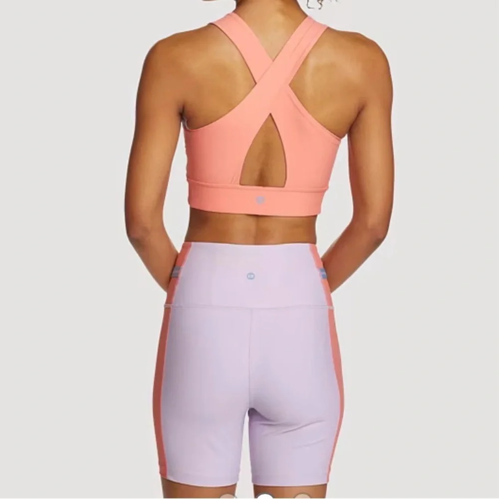 Two Pieces Of Eddie Bauer Lilac and Peach Sports Bra and shorts